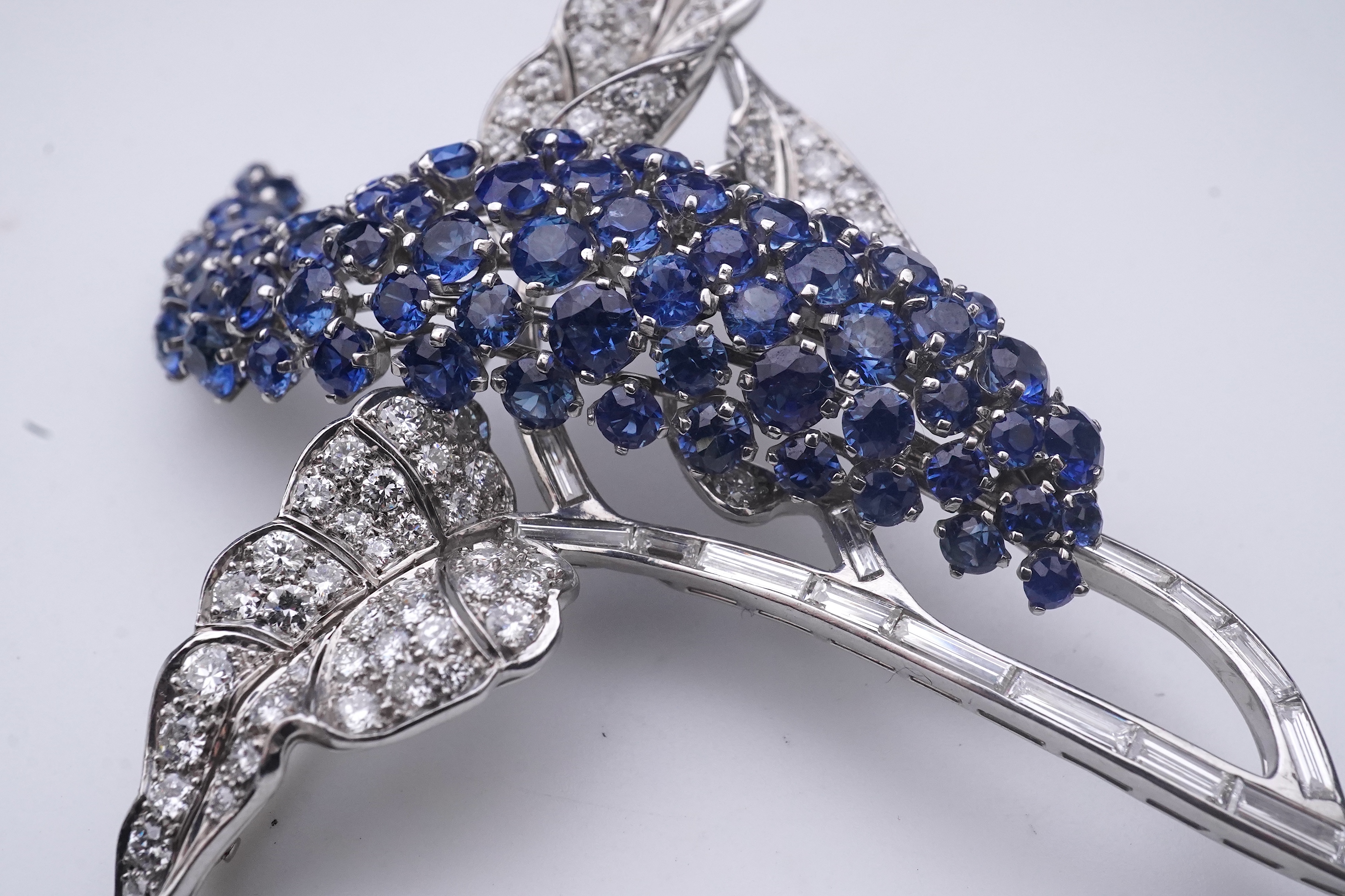 A sapphire and diamond brooch, mid 20th century